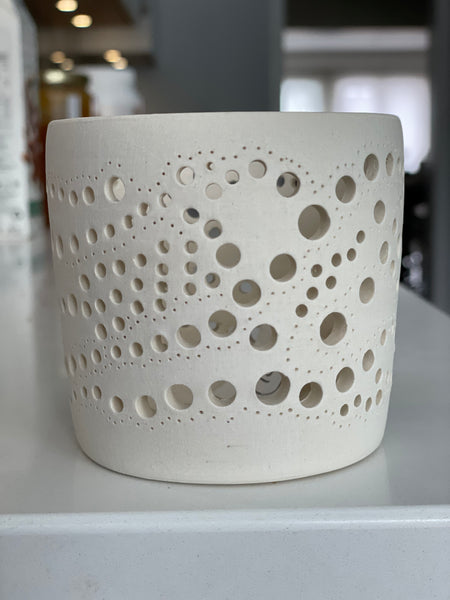 Porcelain handmade Moroccan-inspired tea light with unique cutout design